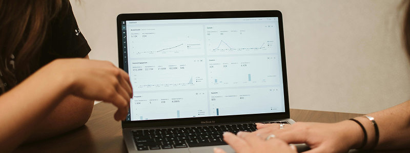 Person viewing analytics dashboard on laptop